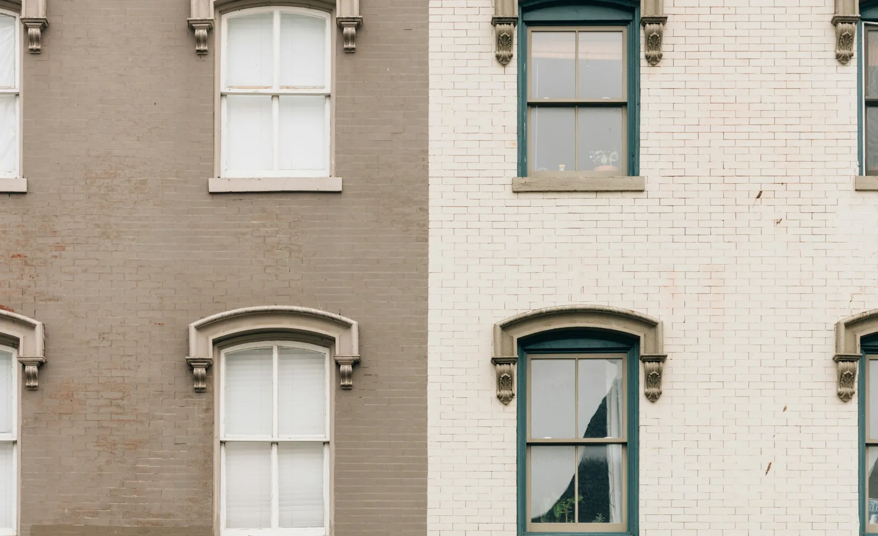 Illustrative Washington, DC rowhouse architecture with warm brick facades and tall windows; not an Adisa Light LLC property.